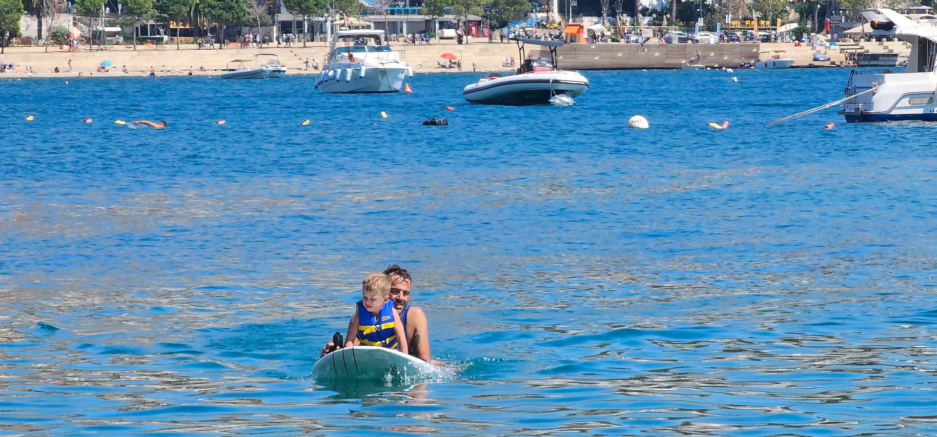 Family eFoil moment on calm water in Sarandë bay