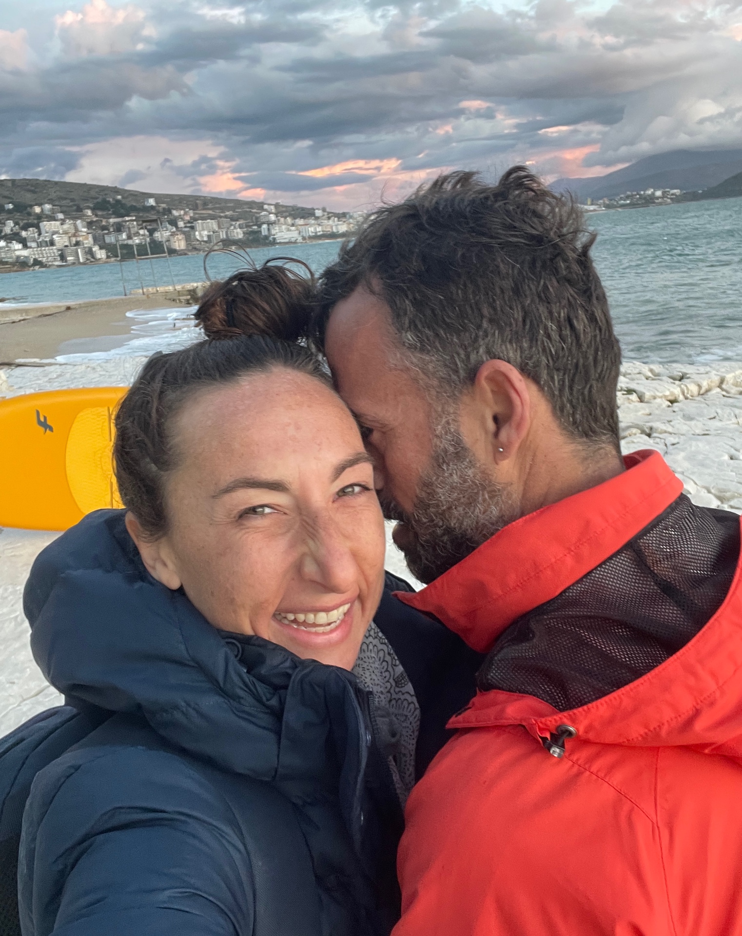 The founders of SurfN'Flow on the shoreline in Sarandë at sunset